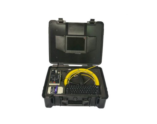 Image of pipe inspection camera system by VICAM MECHATRONICS model V715DK featuring rod & reel with fixed camera head, control station, full Qwerty keyboard, monitor, battery, all together in rugged carrying case.